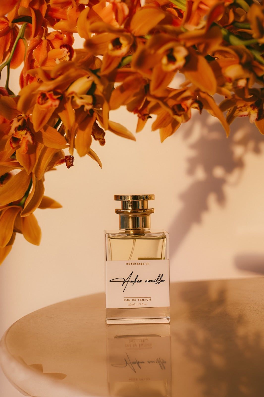 Amber vanilla Eau de Parfum by NORTHSAGE, featuring warm amber and vanilla notes in a sleek bottle.